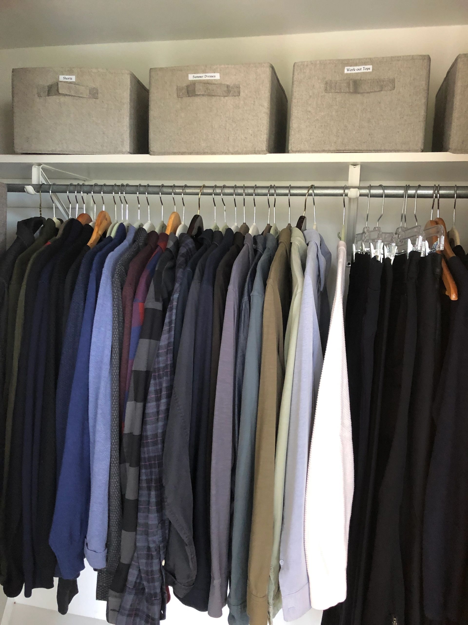 Labeled closet storage and hanging clothes